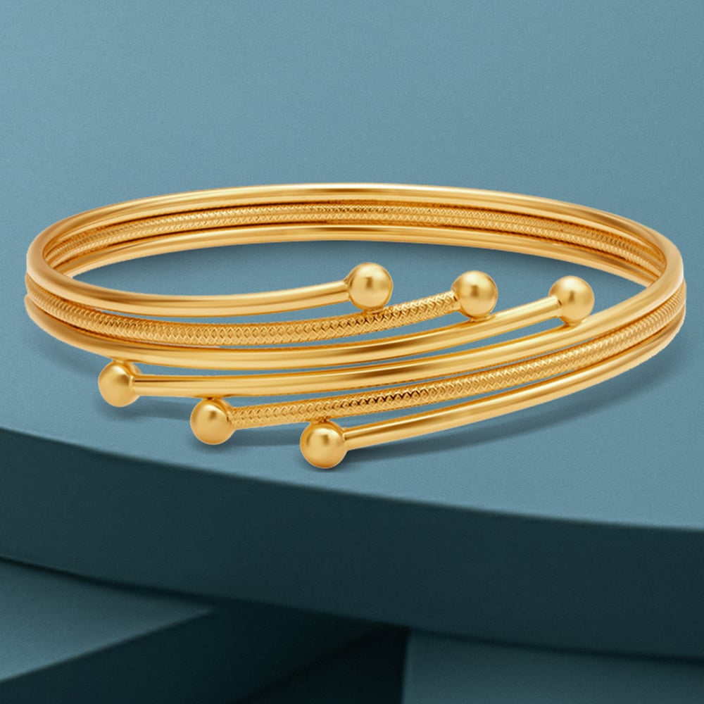 Artistic Gold Bangle
Artistic Gold Bangle