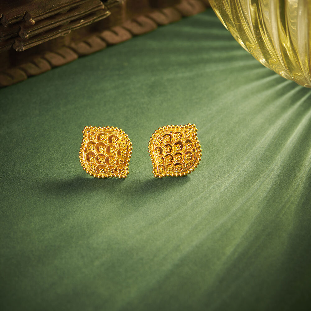 Gold earrings tanishq top