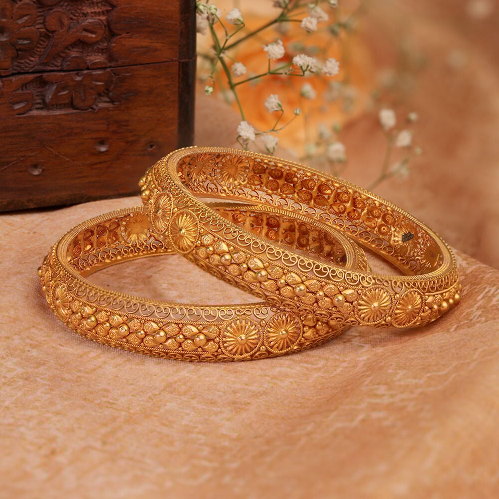 Gold bangles tanishq design on sale