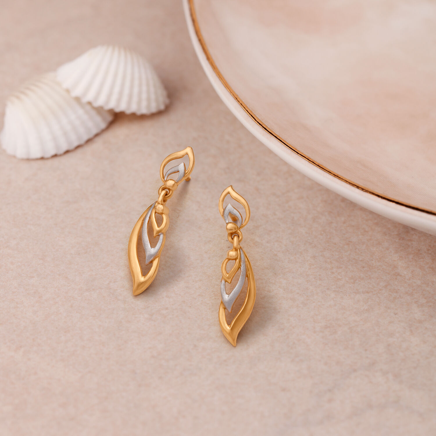 Simple fancy top gold earrings