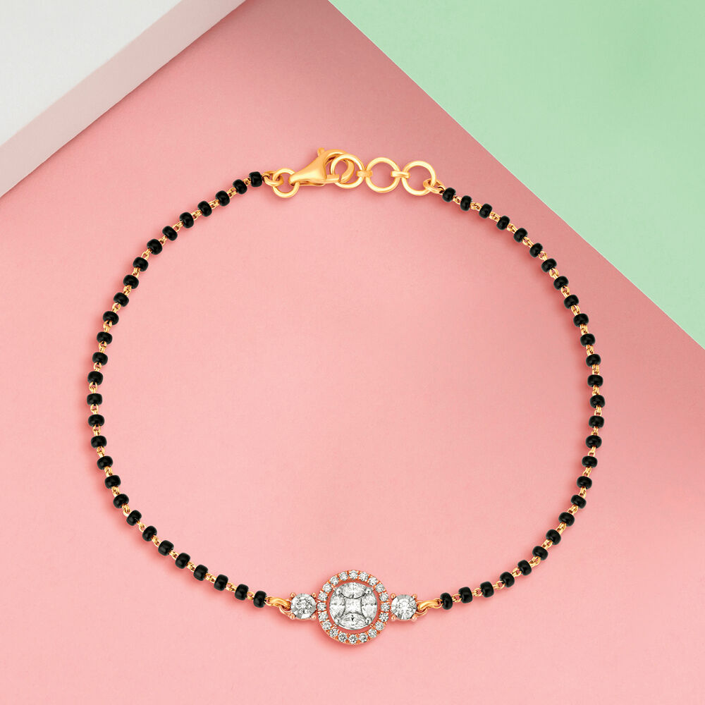 Gold mangalsutra bracelet tanishq sale