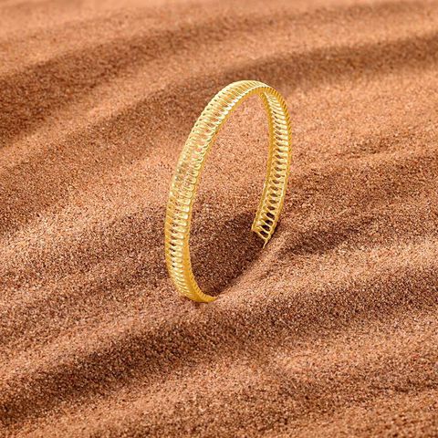 Radiant Textured Gold Bangle