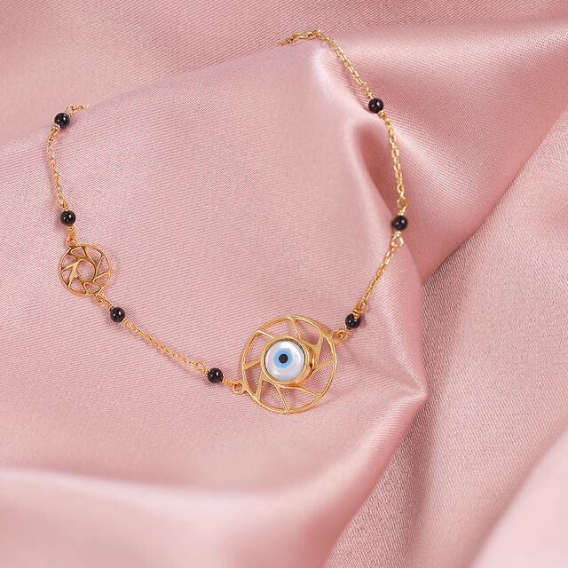 Yellow Gold Multi Charm Evil Eye Bracelet 