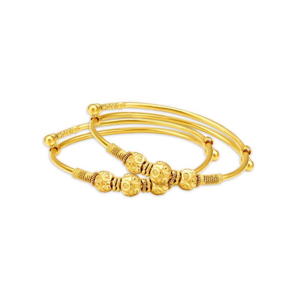 Gold bangles latest designs shop tanishq with price