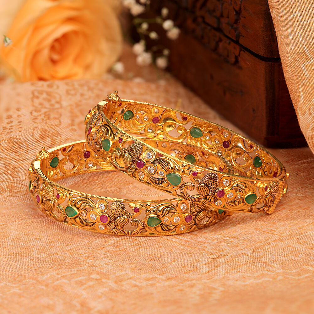 Peacock bangles best sale gold
