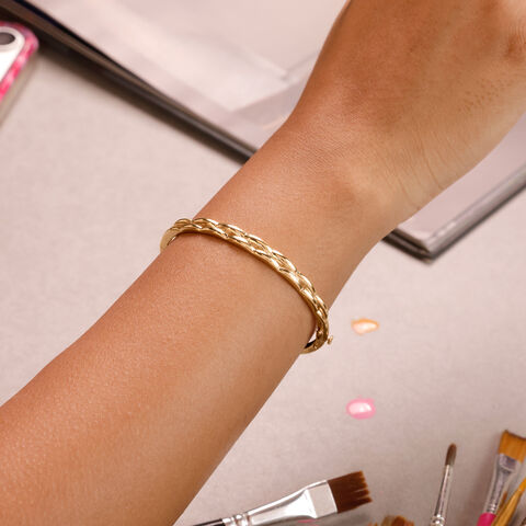 Elegant Twisted Gold Bangle