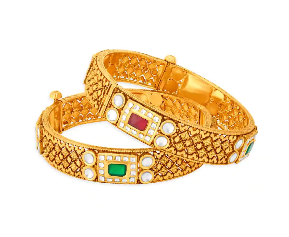 Three gold bracelets and rings - A rigid bracelet t… | Drouot.com