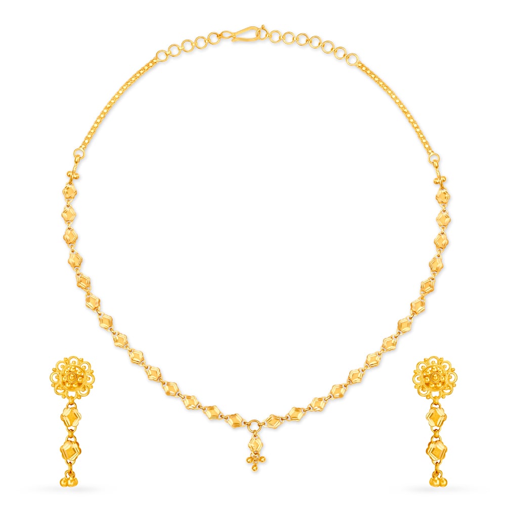 

Distinctive Yellow Gold Etched Necklace and Earrings Set