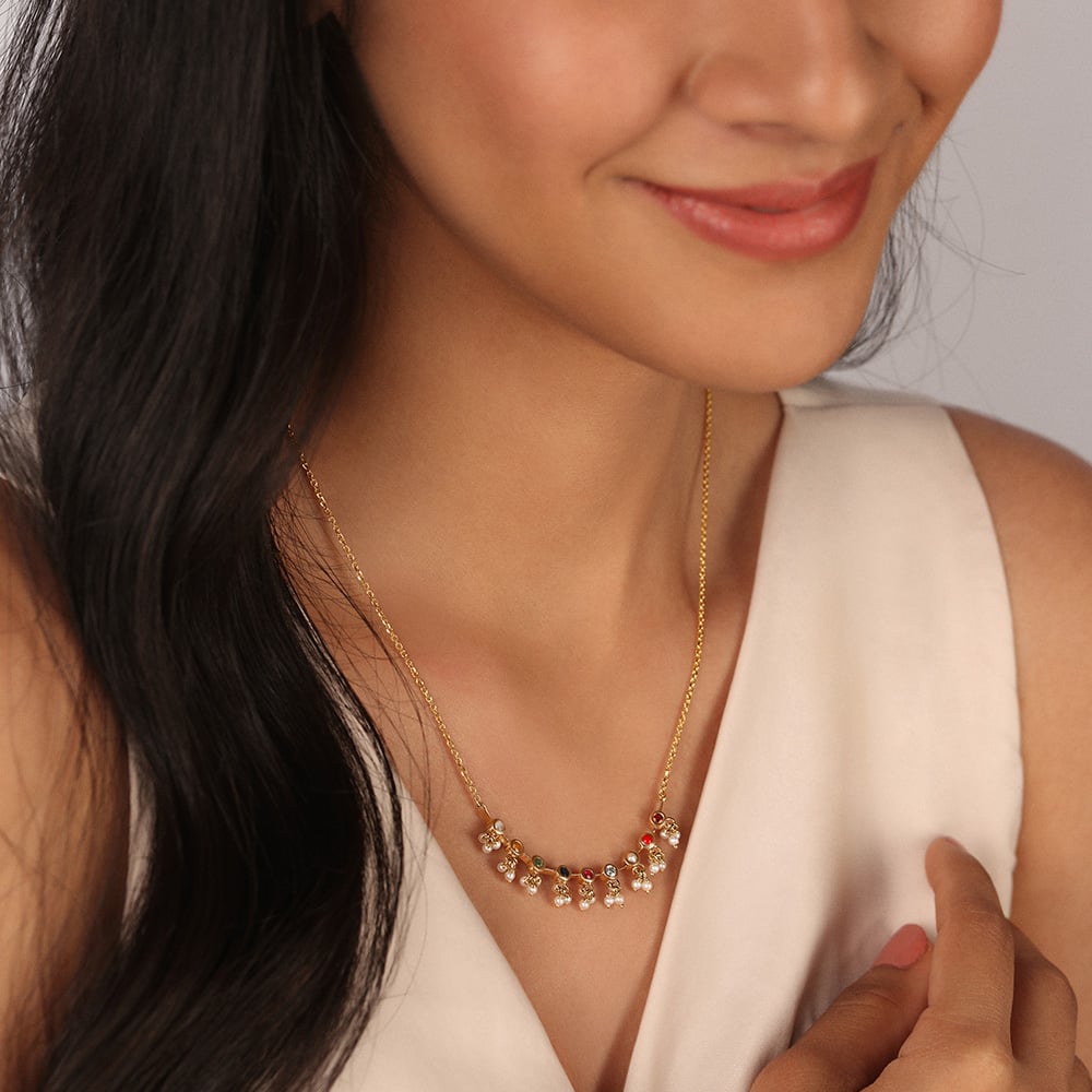 Navratna pendant tanishq hot sale
