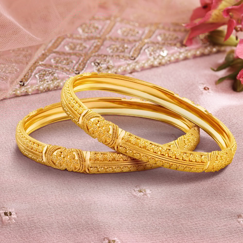 

Intricate Charm Gold Bangles