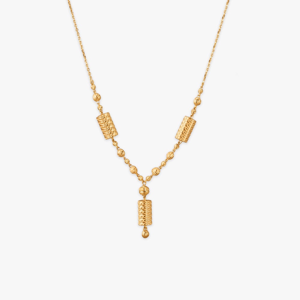 

Carved Bead Gold Necklace