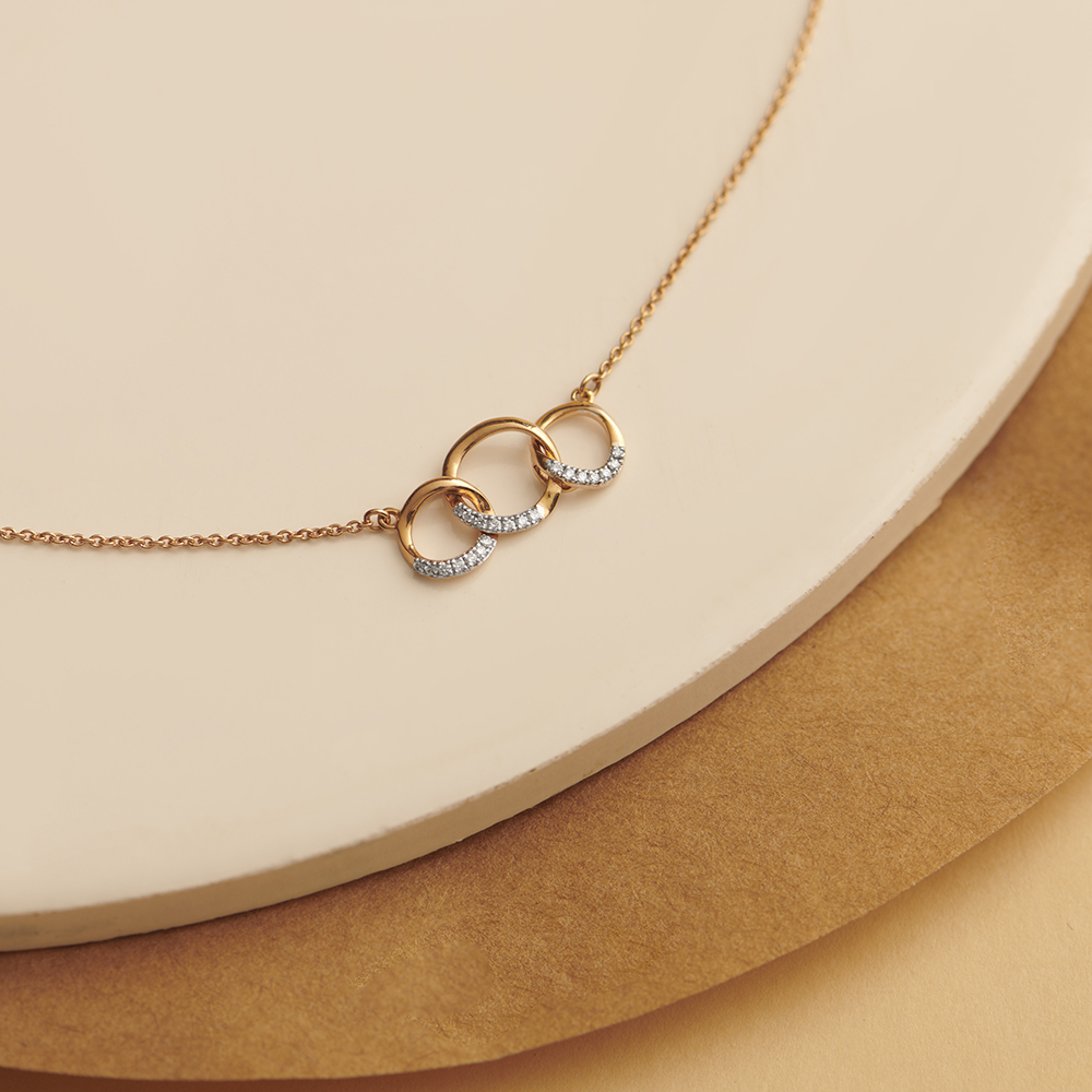 Infinity pendant on sale gold tanishq