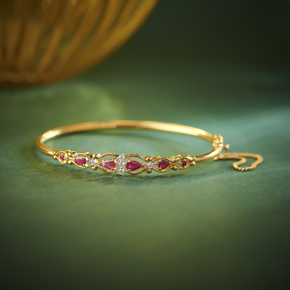 Traditional Diamond and Ruby Adorned Gold Sleek Bangle