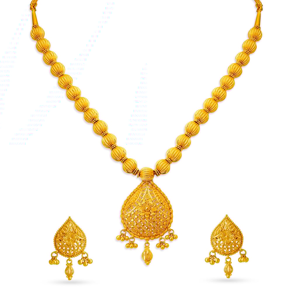 

Stately Gold Nakashi Necklace Set for the Tamil Bride