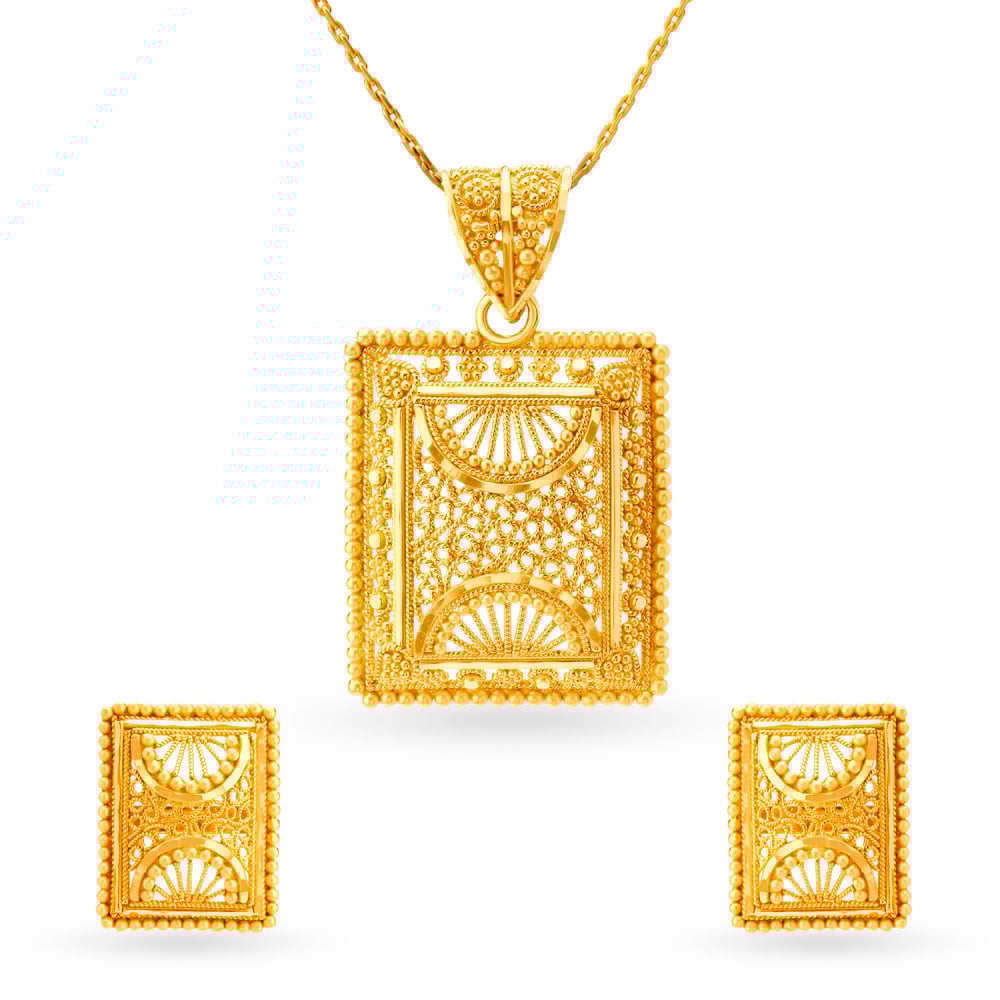 

Elaborate Gold Pendant and Earrings Set
